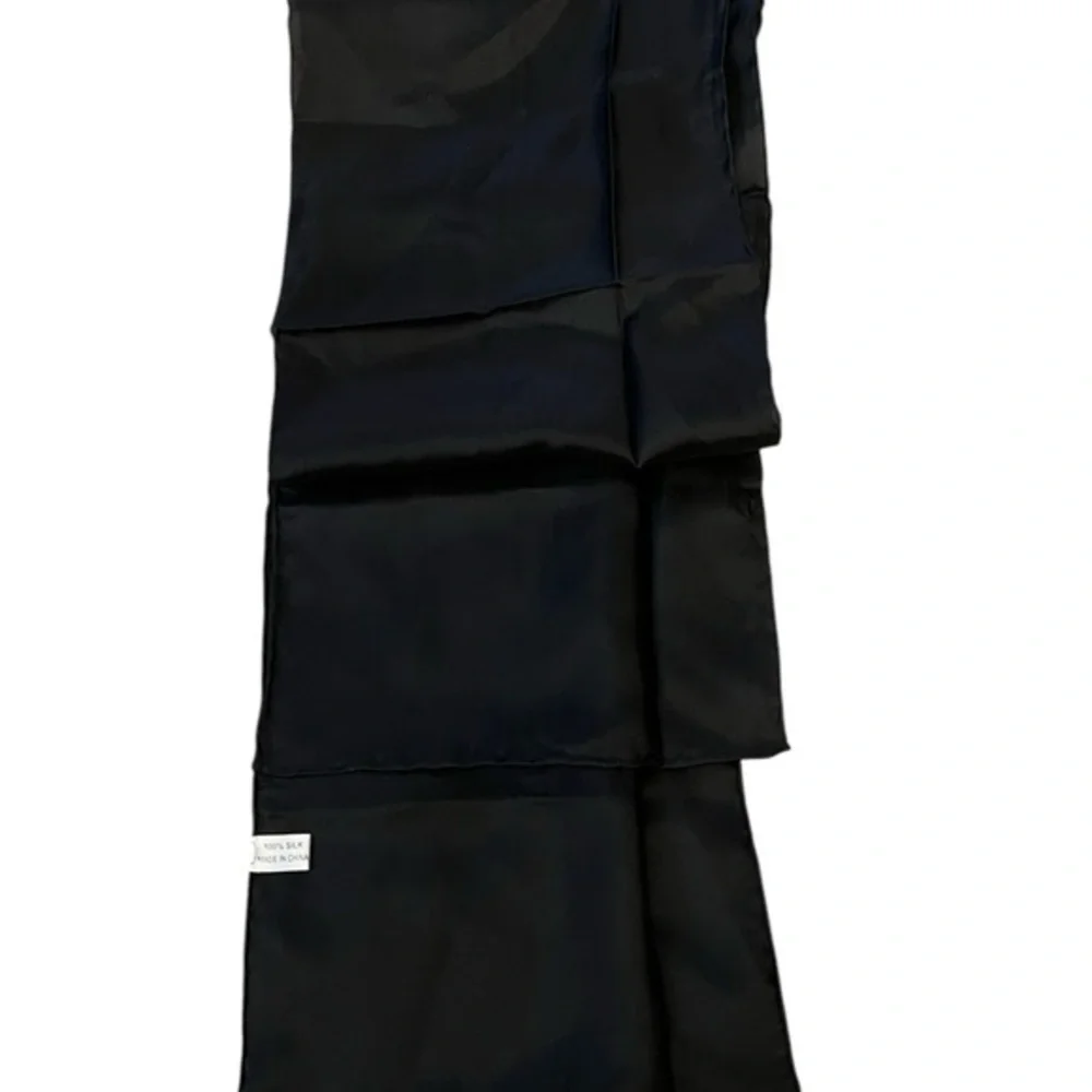 NWOT unbranded oblong black silk scarf with rolled edges, excellent quality